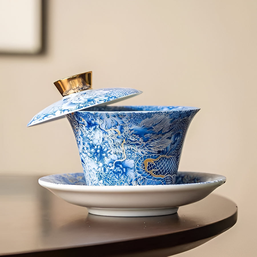 Delicate Blue Floral Porcelain Tea Cup Set with Gold Top