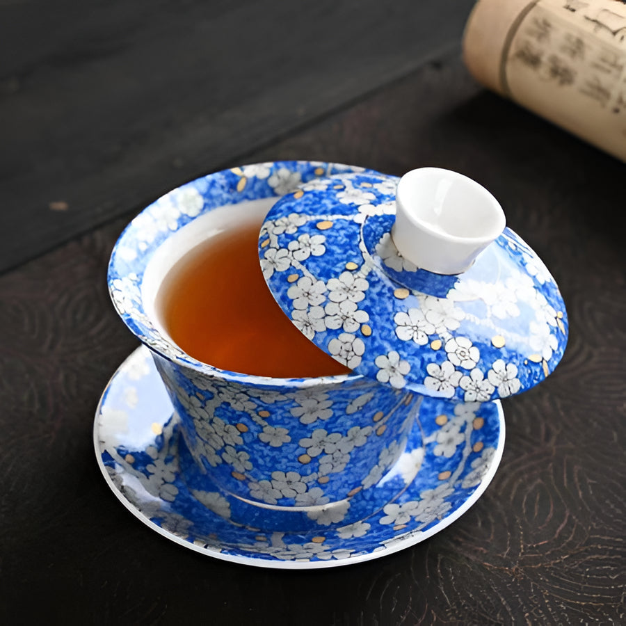 Delicate Blue Floral Porcelain Tea Cup Set with Gold Top