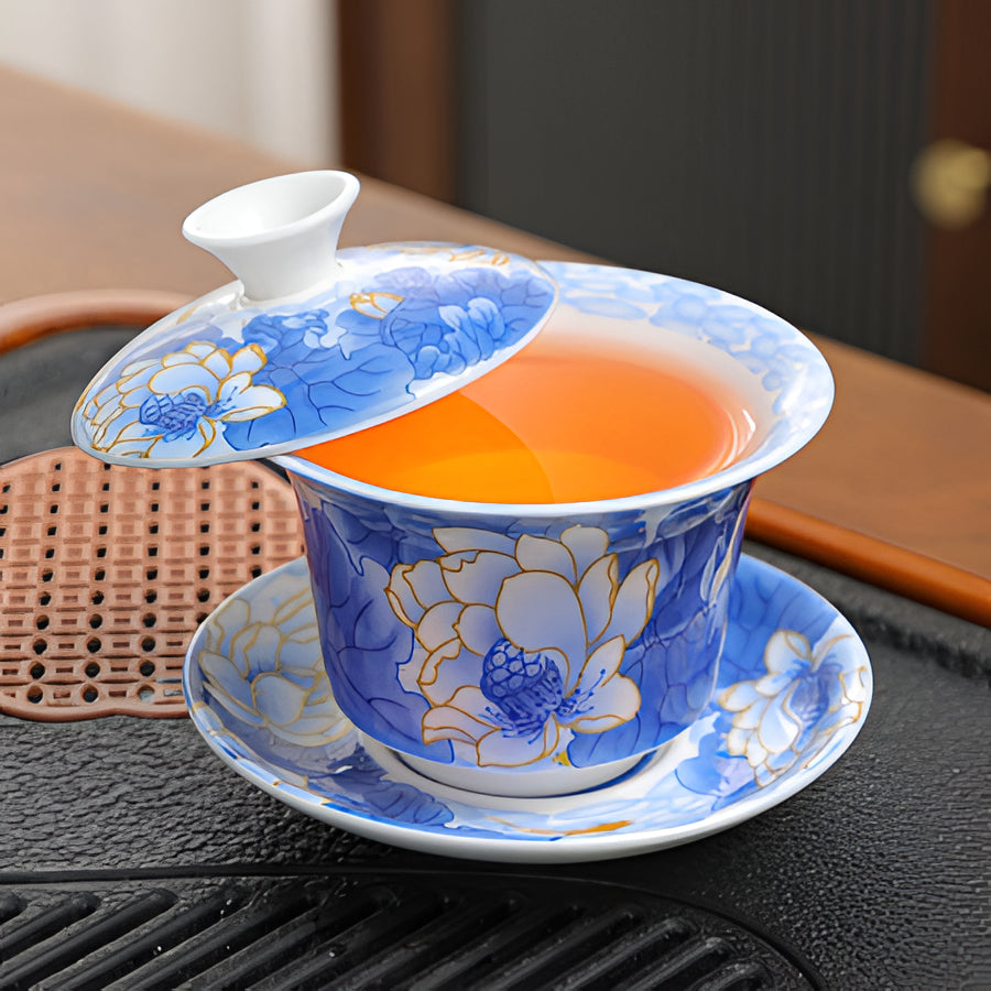 Delicate Blue Floral Porcelain Tea Cup Set with Gold Top