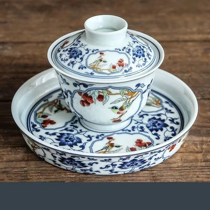 Traditional Asian Tea Set with Infuser and Decorative Cups