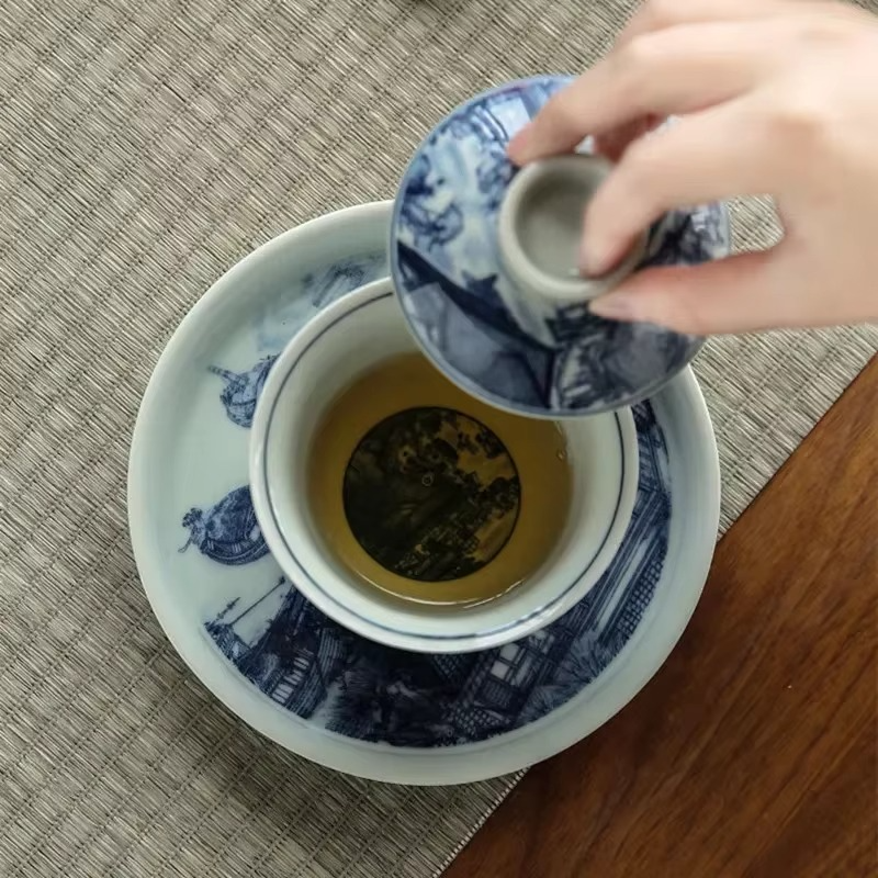 Traditional Asian Tea Set with Infuser and Decorative Cups